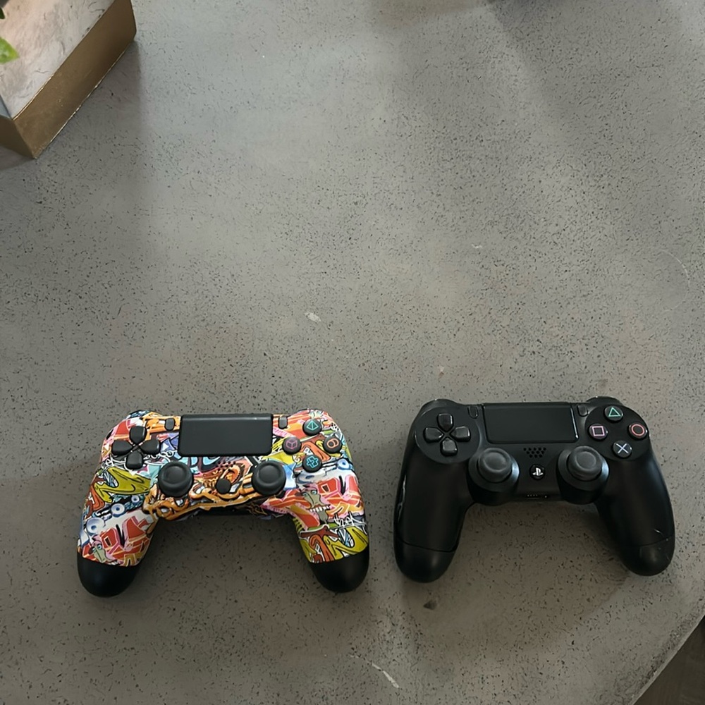 Two ps4 controllers one customized one original controller